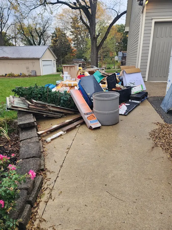 Dumpster being loaded with debris for Demolition Dumpster Rental in East Lyme